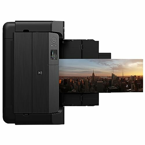 Compact photo printer printing a panoramic cityscape