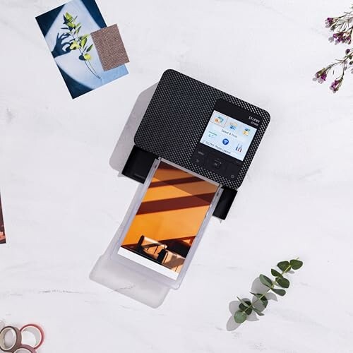 Portable photo printer with printed image and decorative elements