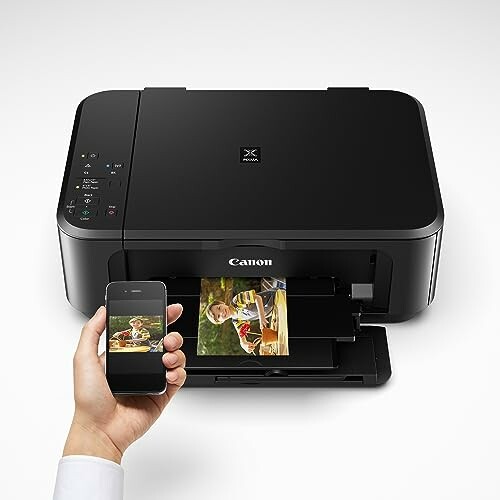 Canon Pixma MG3620 Wireless All-In-One Color Inkjet Printer printing a photo from a smartphone